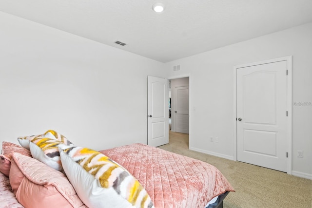 2355 White Lilly Dr, Kissimmee, FL 34747 - bedroom featuring light carpet and baseboards