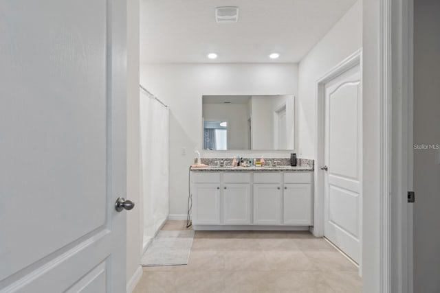 2355 White Lilly Dr, Kissimmee, FL 34747 - bathroom with double vanity, tile patterned floors, recessed lighting, and curtained shower