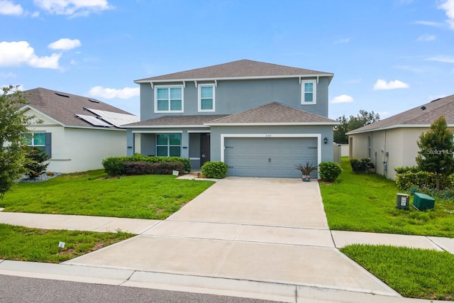 2355 White Lilly Dr, Kissimmee, FL 34747 - traditional-style house featuring stucco siding, an attached garage, a shingled roof, and a front lawn