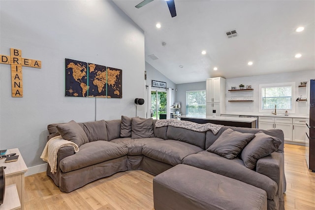 3706 Andover Cay Blvd, Orlando, FL 32825 - living room with a ceiling fan, healthy amount of natural light, recessed lighting, light wood-style flooring, and high vaulted ceiling