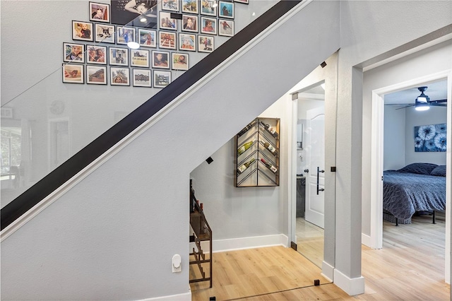 3706 Andover Cay Blvd, Orlando, FL 32825 - staircase with wood finished floors and a ceiling fan