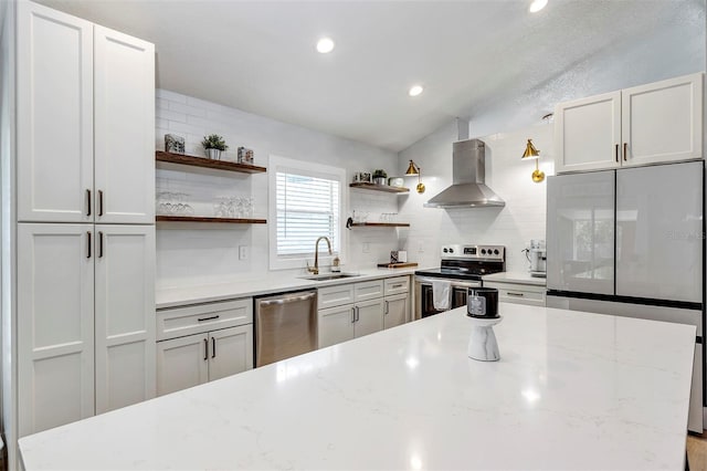 3706 Andover Cay Blvd, Orlando, FL 32825 - kitchen featuring stainless steel appliances, open shelves, wall chimney range hood, decorative backsplash, and vaulted ceiling