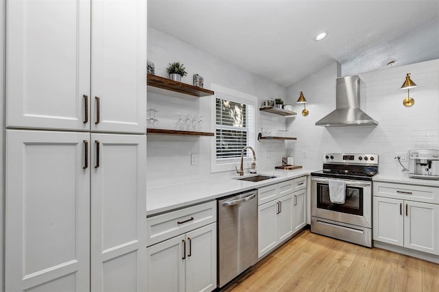 3706 Andover Cay Blvd, Orlando, FL 32825 - kitchen with stainless steel appliances, open shelves, wall chimney exhaust hood, decorative backsplash, and recessed lighting