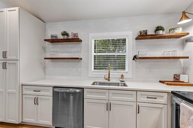3706 Andover Cay Blvd, Orlando, FL 32825 - kitchen with stainless steel appliances, open shelves, light countertops, and white cabinetry