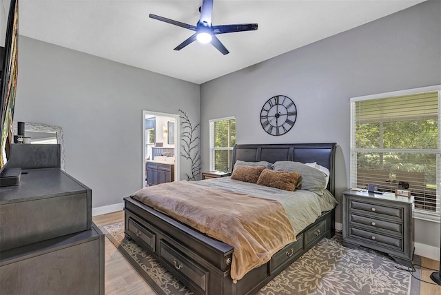 3706 Andover Cay Blvd, Orlando, FL 32825 - bedroom featuring light wood finished floors, a ceiling fan, and connected bathroom