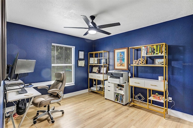 3706 Andover Cay Blvd, Orlando, FL 32825 - office space featuring a textured wall, a ceiling fan, a textured ceiling, and wood finished floors