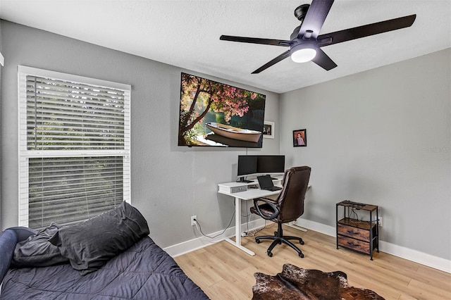3706 Andover Cay Blvd, Orlando, FL 32825 - bedroom with wood finished floors, a ceiling fan, a textured ceiling, and an office area