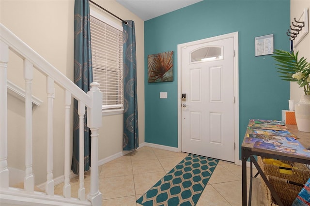 8912 Rhodes St, Kissimmee, FL 34747 - entryway featuring stairway and light tile patterned flooring