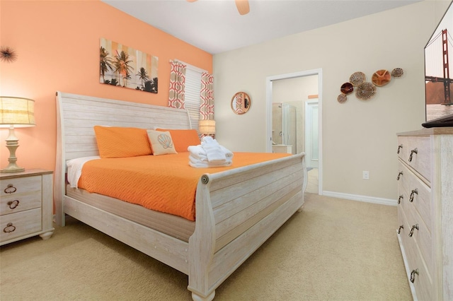 8912 Rhodes St, Kissimmee, FL 34747 - bedroom with light colored carpet, connected bathroom, and a ceiling fan
