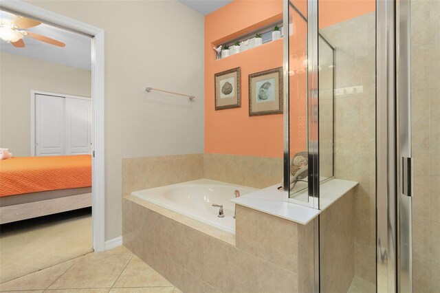 8912 Rhodes St, Kissimmee, FL 34747 - bathroom featuring a garden tub, tile patterned floors, a shower stall, and ceiling fan
