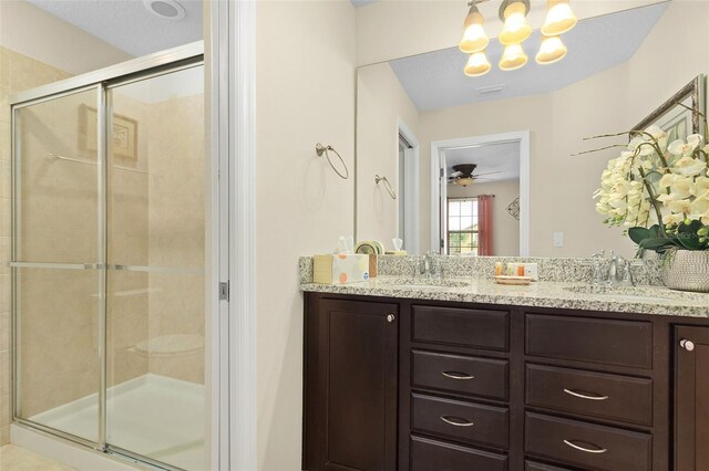 8912 Rhodes St, Kissimmee, FL 34747 - full bath with a shower stall, double vanity, a chandelier, and a ceiling fan