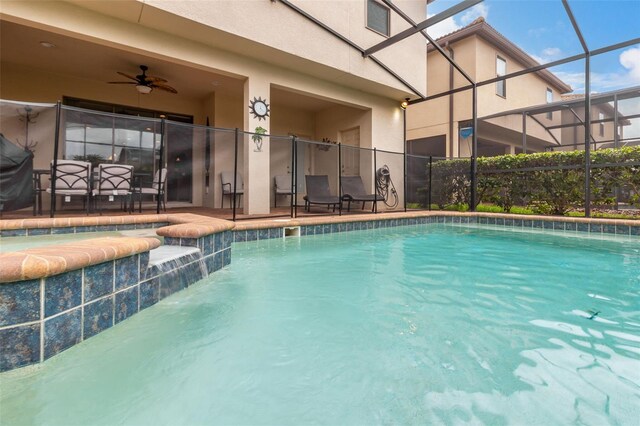 8912 Rhodes St, Kissimmee, FL 34747 - view of swimming pool featuring a patio area, ceiling fan, glass enclosure, and a pool with connected hot tub