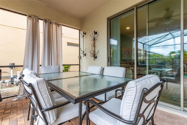 8912 Rhodes St, Kissimmee, FL 34747 - dining room featuring a sunroom, brick patterned flooring, and healthy amount of natural light