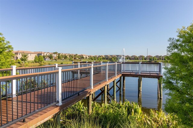 8912 Rhodes St, Kissimmee, FL 34747 - dock area with a residential view and a water view