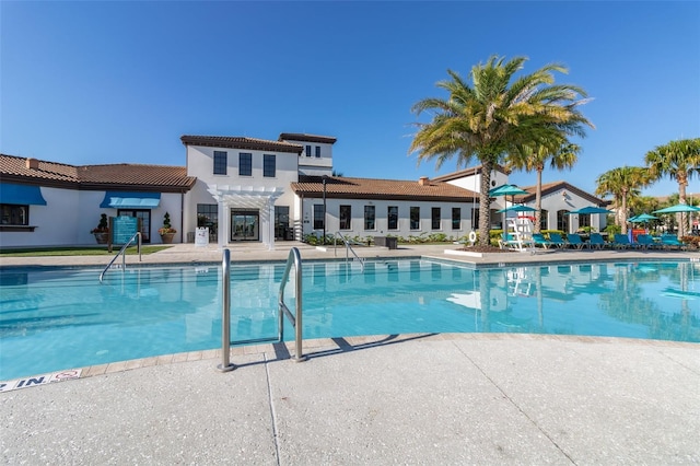 8912 Rhodes St, Kissimmee, FL 34747 - community pool with a patio area