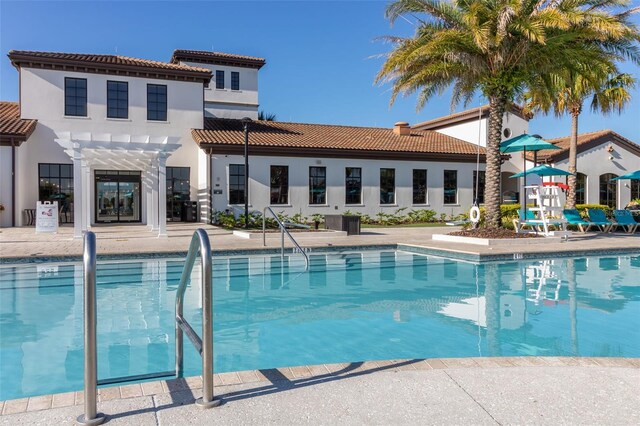 8912 Rhodes St, Kissimmee, FL 34747 - community pool featuring a pergola and a patio area