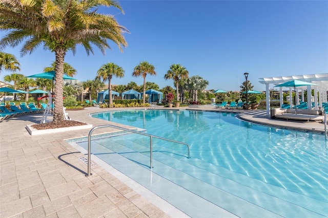 8912 Rhodes St, Kissimmee, FL 34747 - community pool featuring a patio