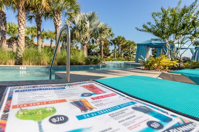 8912 Rhodes St, Kissimmee, FL 34747 - view of home's community with a gazebo and a pool