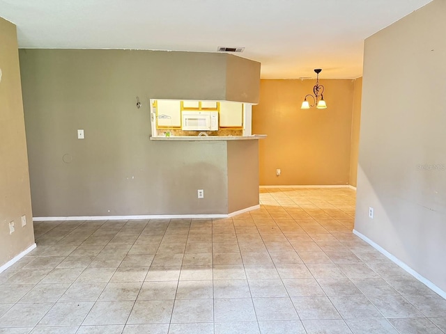 249 Afton Sq Unit 112, Altamonte Springs, FL 32714 - unfurnished room with a chandelier and light tile patterned floors