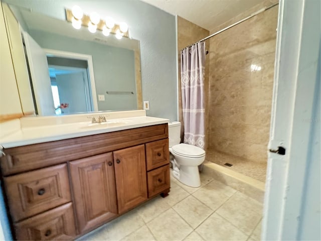 249 Afton Sq Unit 112, Altamonte Springs, FL 32714 - bathroom with vanity, a tile shower, and tile patterned floors