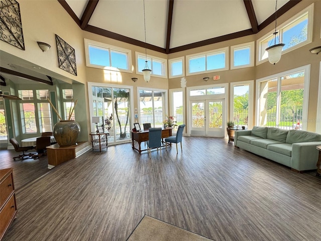 249 Afton Sq Unit 112, Altamonte Springs, FL 32714 - living room featuring high vaulted ceiling, beamed ceiling, healthy amount of natural light, dark wood-style floors, and french doors