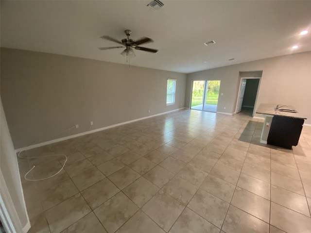 180 Ferguson St SE, Palm Bay, FL 32909 - empty room featuring light tile patterned flooring, ceiling fan, and recessed lighting