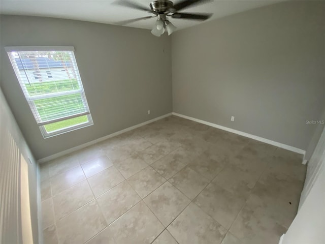 180 Ferguson St SE, Palm Bay, FL 32909 - unfurnished room with light tile patterned flooring and ceiling fan