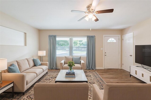 5908 Laconia Rd, Orlando, FL 32808 - living room with wood finished floors, plenty of natural light, and ceiling fan