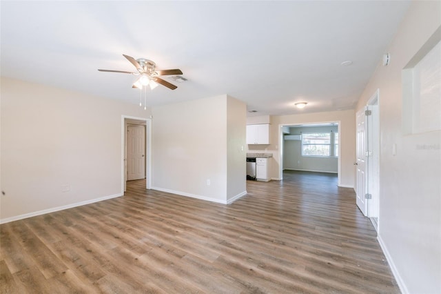 5908 Laconia Rd, Orlando, FL 32808 - unfurnished living room featuring wood finished floors and a ceiling fan