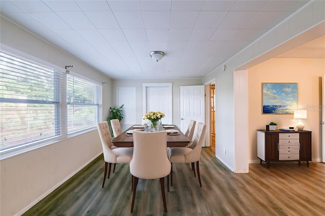 5908 Laconia Rd, Orlando, FL 32808 - dining space featuring wood finished floors and crown molding
