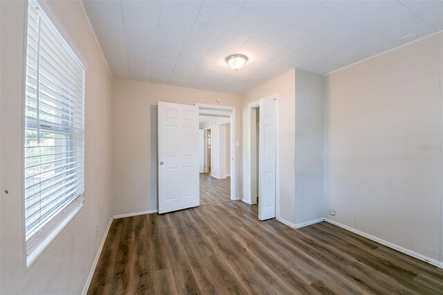 5908 Laconia Rd, Orlando, FL 32808 - unfurnished room featuring dark wood-type flooring and baseboards