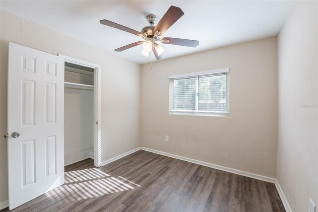 5908 Laconia Rd, Orlando, FL 32808 - unfurnished bedroom with wood finished floors, a closet, and a ceiling fan
