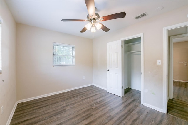 5908 Laconia Rd, Orlando, FL 32808 - unfurnished bedroom featuring dark wood-type flooring, a closet, and a ceiling fan