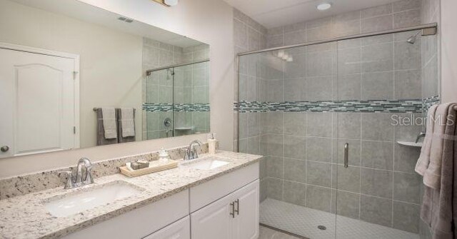 61 Bruce Ln, Palm Coast, FL 32137 - full bathroom with double vanity and a stall shower