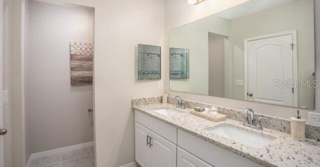 61 Bruce Ln, Palm Coast, FL 32137 - full bathroom featuring double vanity and tile patterned floors