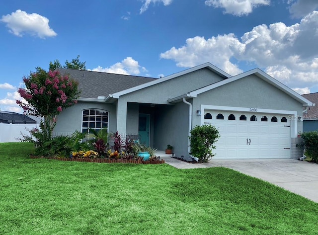 2650 Autumn Creek Cir, Kissimmee, FL 34747 - single story home featuring stucco siding, a garage, a front lawn, and driveway
