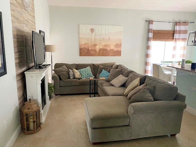 2650 Autumn Creek Cir, Kissimmee, FL 34747 - living room with a fireplace and baseboards
