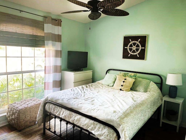 2650 Autumn Creek Cir, Kissimmee, FL 34747 - bedroom with wood finished floors and a ceiling fan