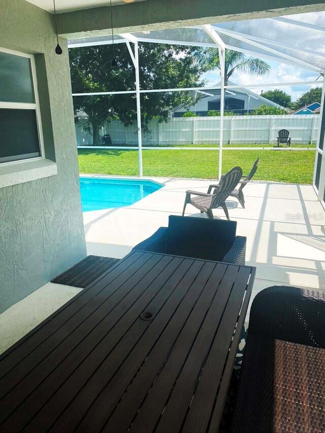 2650 Autumn Creek Cir, Kissimmee, FL 34747 - view of pool featuring a fenced backyard, a patio area, a lanai, and a wooden deck