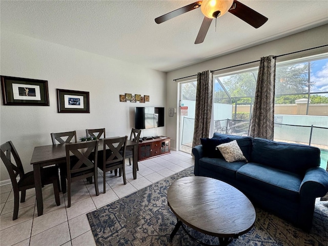 7682 Sir Kaufmann Ct, Kissimmee, FL 34747 - living room featuring light tile patterned flooring, healthy amount of natural light, a textured ceiling, and ceiling fan