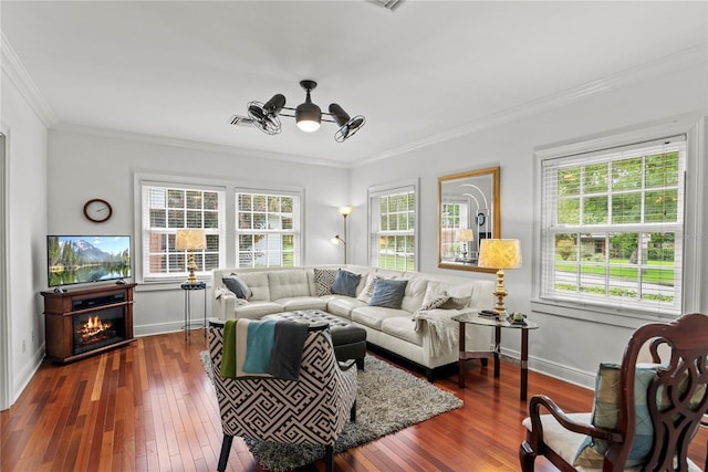 2312 S Summerlin Ave, Orlando, FL 32806 - living area with dark wood finished floors, healthy amount of natural light, and ornamental molding