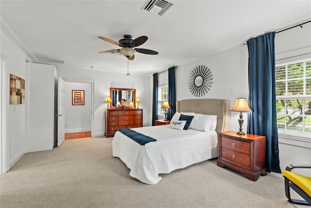 2312 S Summerlin Ave, Orlando, FL 32806 - bedroom with light colored carpet, multiple windows, ornamental molding, and a ceiling fan