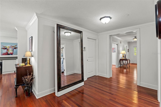 2312 S Summerlin Ave, Orlando, FL 32806 - hallway with dark wood finished floors, crown molding, and a textured ceiling