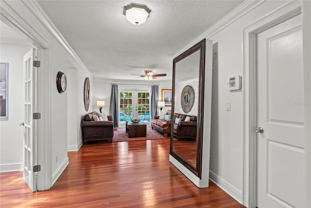 2312 S Summerlin Ave, Orlando, FL 32806 - hallway with hardwood / wood-style flooring, french doors, a textured ceiling, and crown molding
