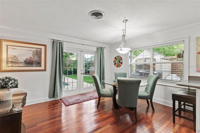 2312 S Summerlin Ave, Orlando, FL 32806 - dining area with french doors, hardwood / wood-style flooring, crown molding, and a textured ceiling
