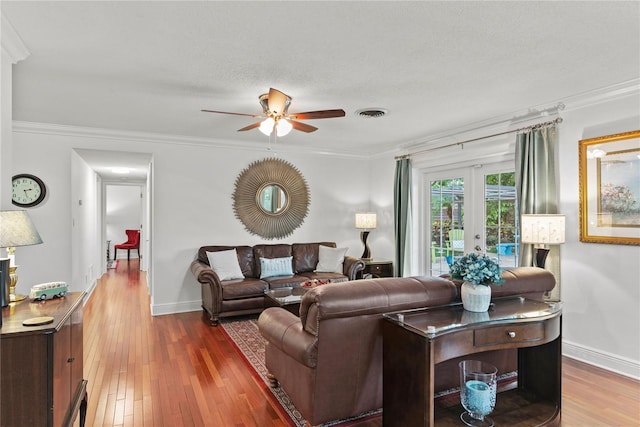 2312 S Summerlin Ave, Orlando, FL 32806 - living area featuring ceiling fan, hardwood / wood-style flooring, french doors, and crown molding