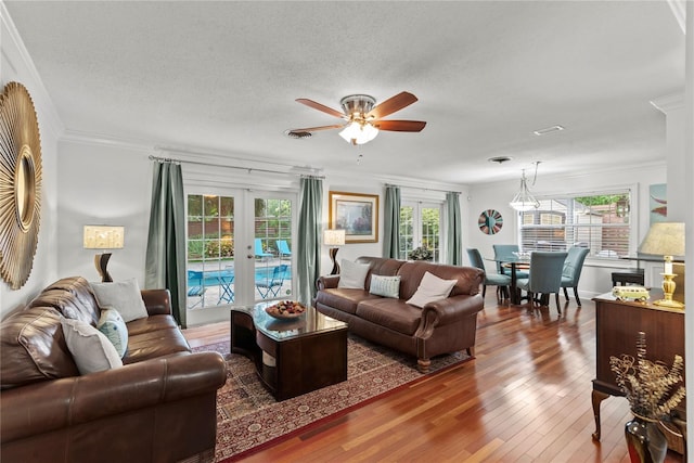 2312 S Summerlin Ave, Orlando, FL 32806 - living area featuring ceiling fan, hardwood / wood-style flooring, french doors, crown molding, and a textured ceiling