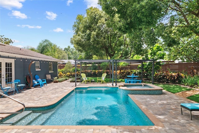 2312 S Summerlin Ave, Orlando, FL 32806 - view of pool featuring french doors, a patio area, and a pool with connected hot tub