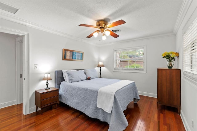 2312 S Summerlin Ave, Orlando, FL 32806 - bedroom with multiple windows, dark wood-type flooring, ornamental molding, a ceiling fan, and a textured ceiling