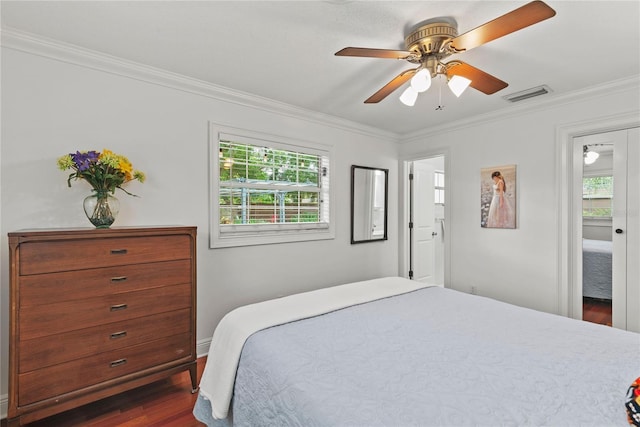 2312 S Summerlin Ave, Orlando, FL 32806 - bedroom with ornamental molding, dark wood-type flooring, multiple windows, and ceiling fan